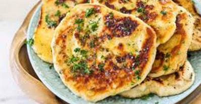 The Real Food Academy Tampa fresh garlic naan bread.