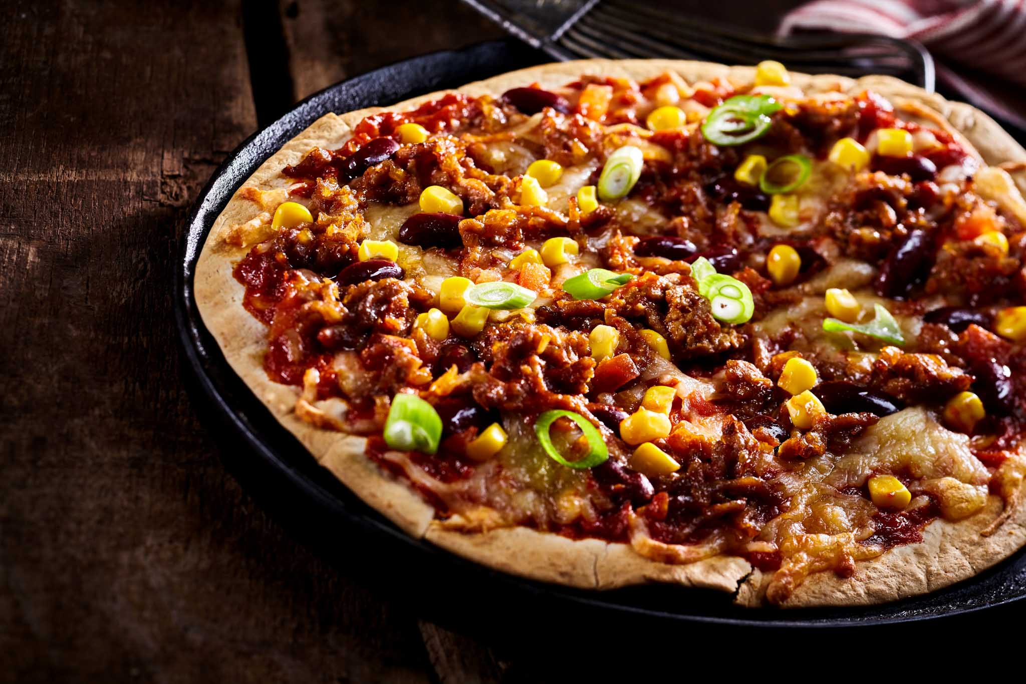 The Real Food Academy Tampa fresh made mexican pizza with beans spread.