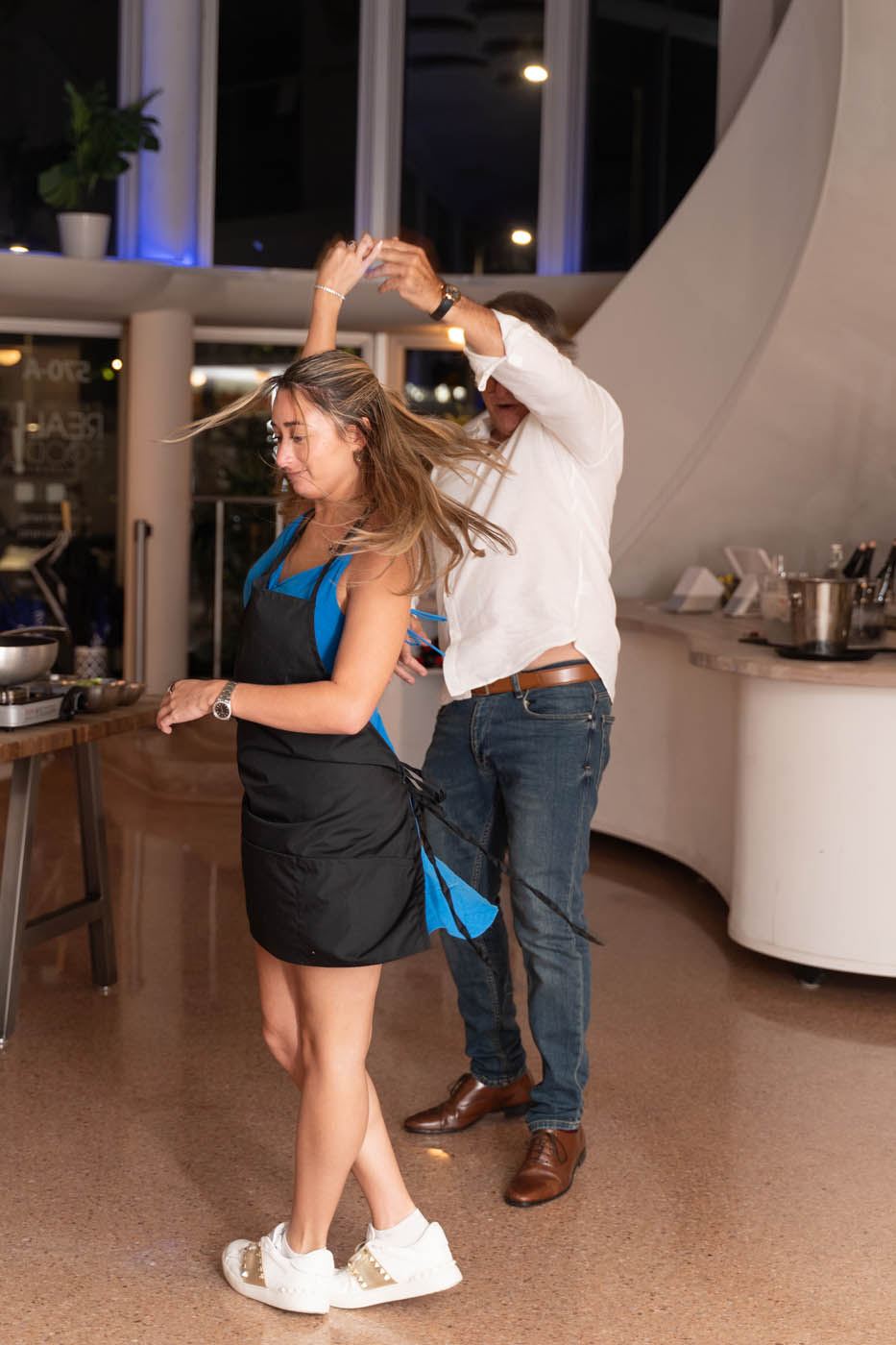A corporate team cooking fresh pot stickers at our corporate party venue in Tampa, FL.