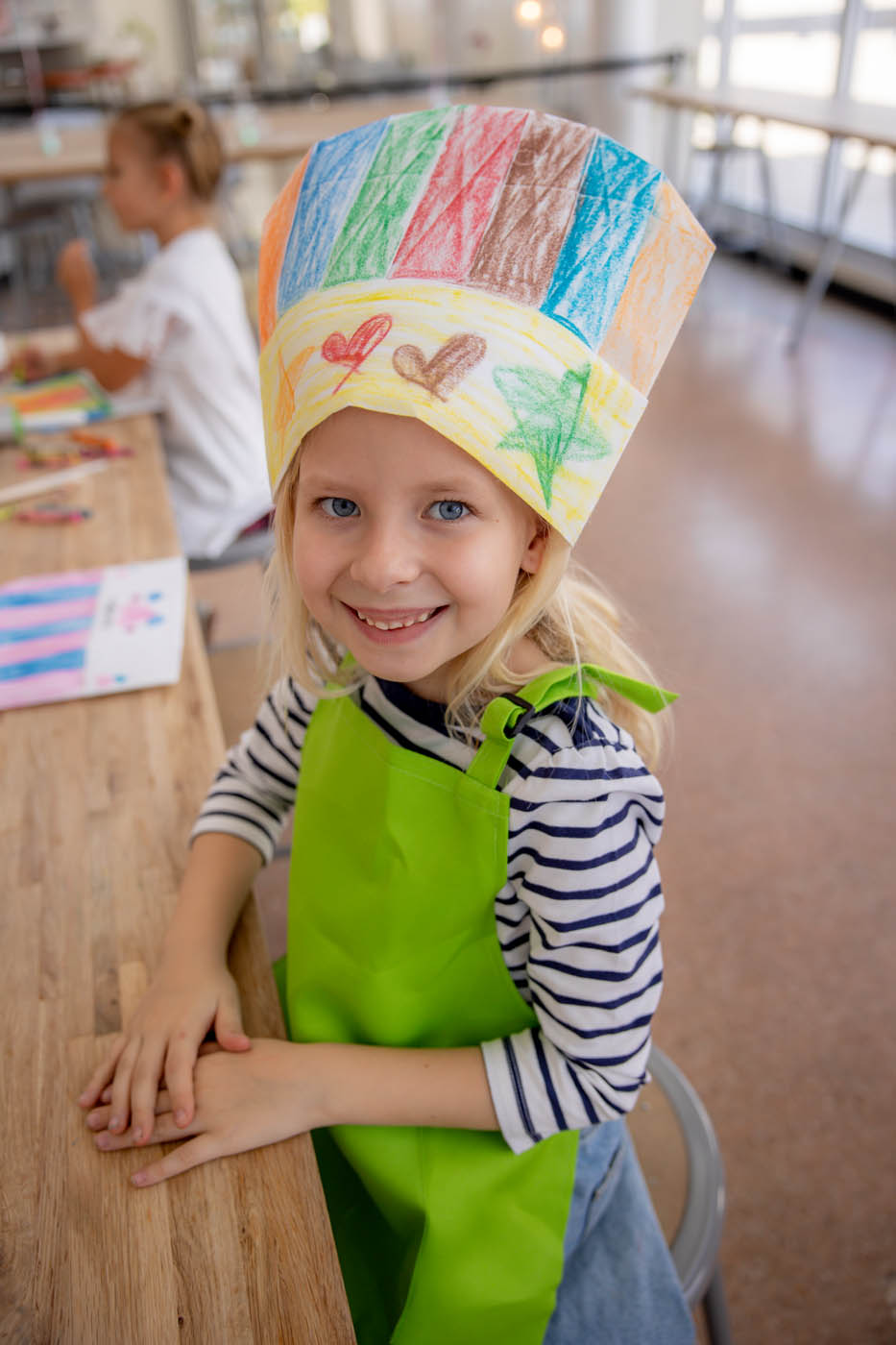 A little kid with a rolling pin and a kids cooking birthday party in Tampa, FL.