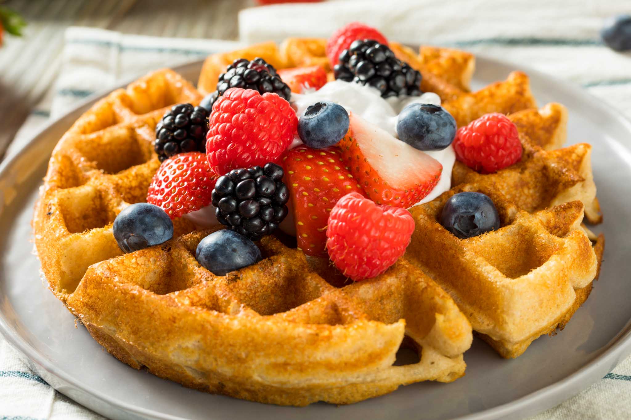 Fresh waffles with organic fruit at The Real Food Academy Tampa.