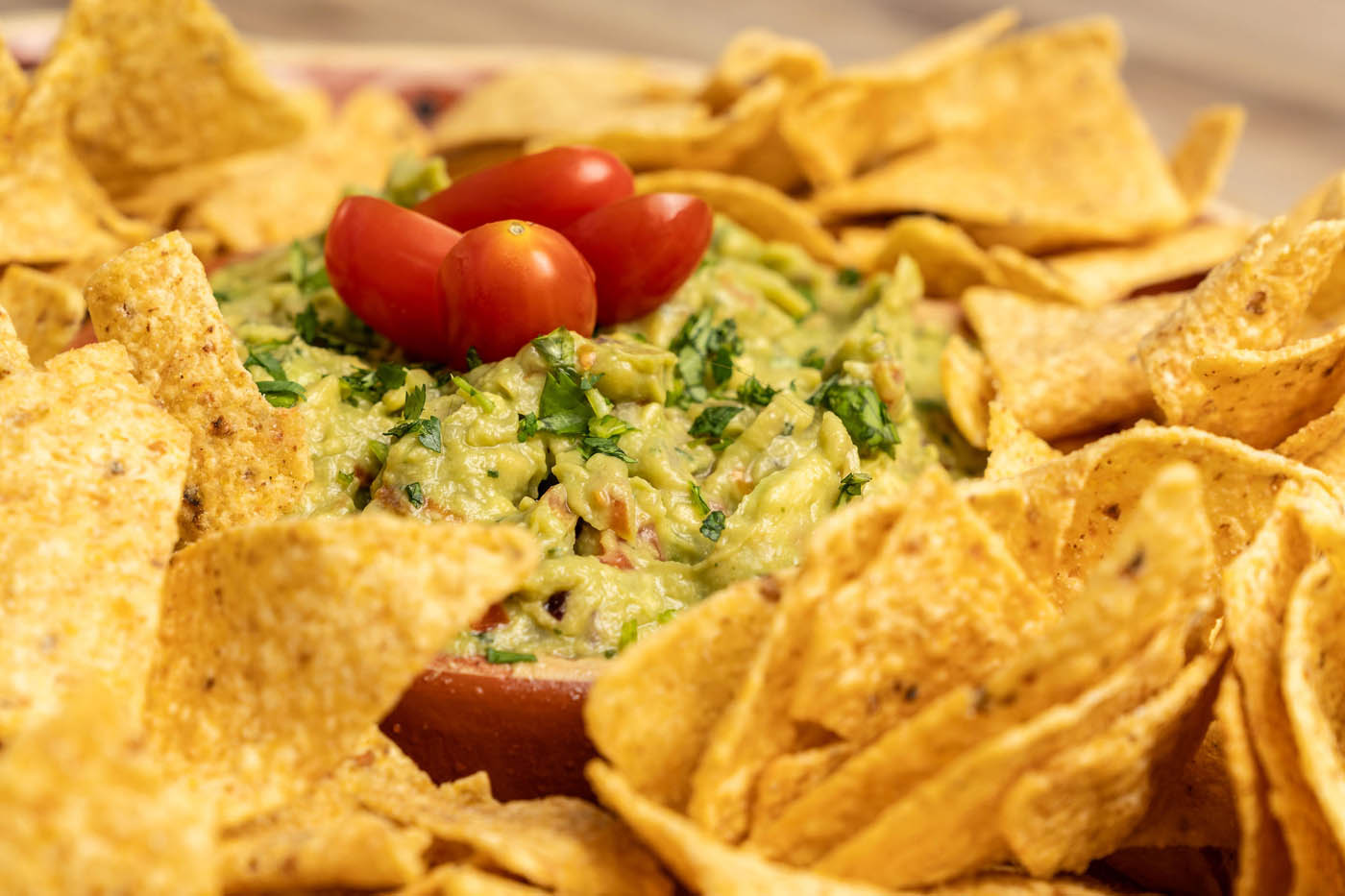 Guacamole dip with tortilla chips at The Real Food Academy Tampa.