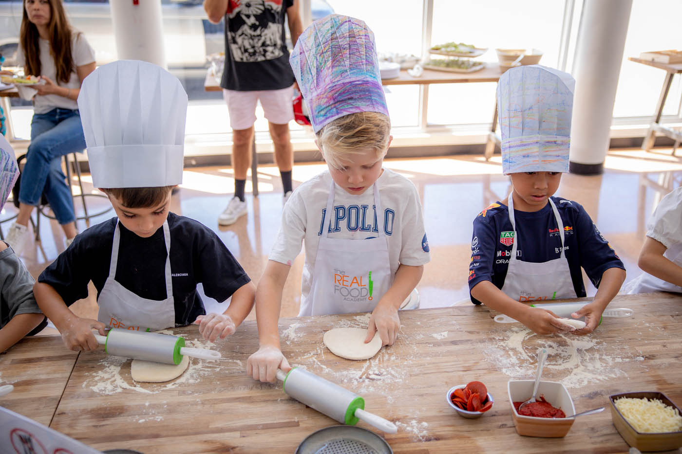 Two young kids making fresh food at Tampa kids birthday party places. 