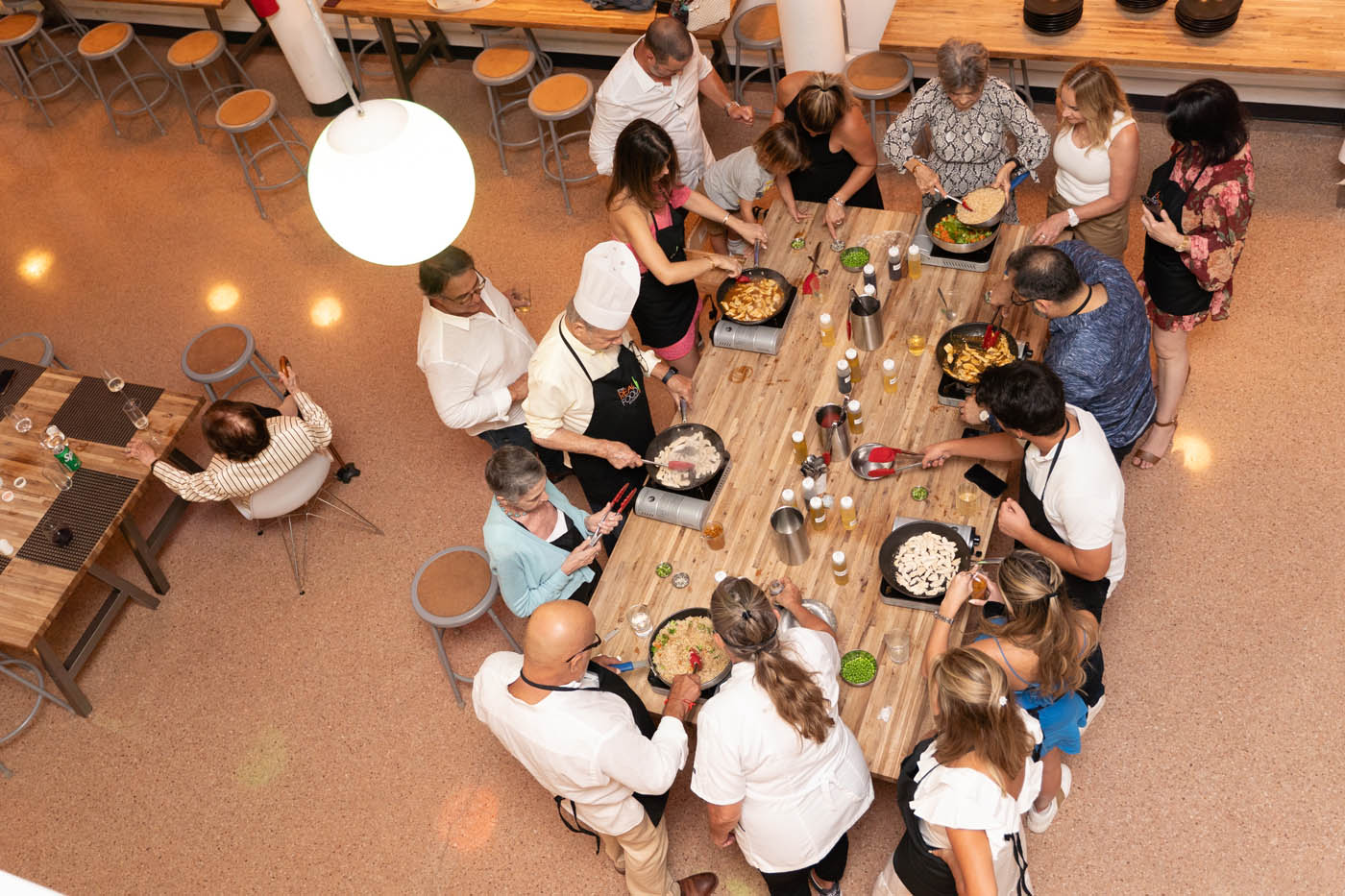 A family at a The Real Food Academy cooking table, book now with our birthday celebration place in Tampa, FL.