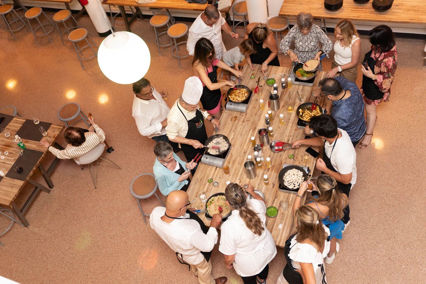 A overhead table view of a private family cooking class.