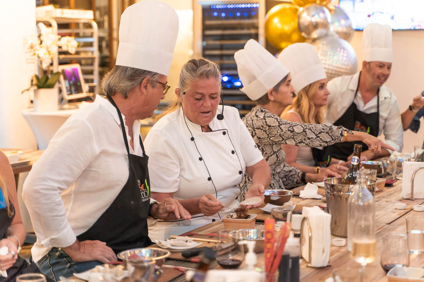 A The Real Food Academy Tampa chef teaching a corporate team at our corporate party venue in Tampa, FL.