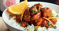 The Real Food Academy Orlando orange peel chicken on white rice with vegtables.