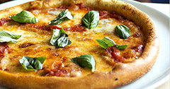 The Real Food Academy Tampa fresh made dish pizza with basil.
