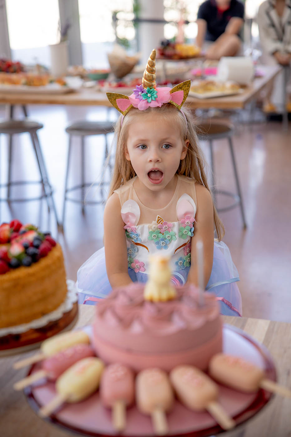 A little girl celebrating her birthday at one of The Real Food Academy's Tampa indoor birthday party venues.