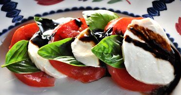 The Real Food Academy Orlando caprese salad course with tomatoes and cheese.